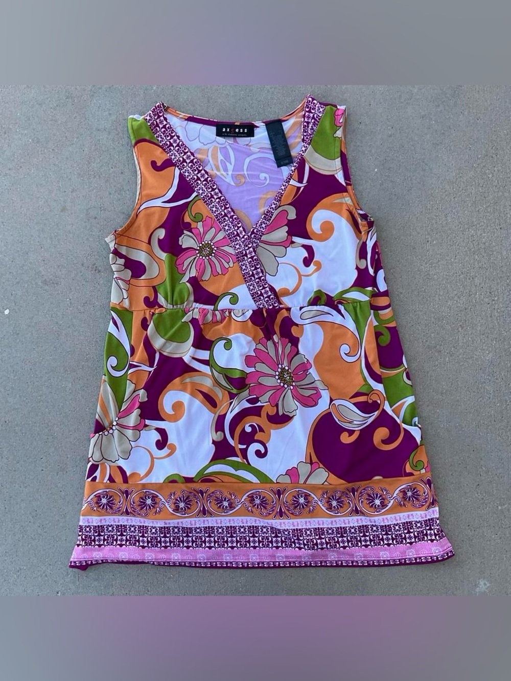 Axcess multicoloured floral top with V-neck and ruffle hem.